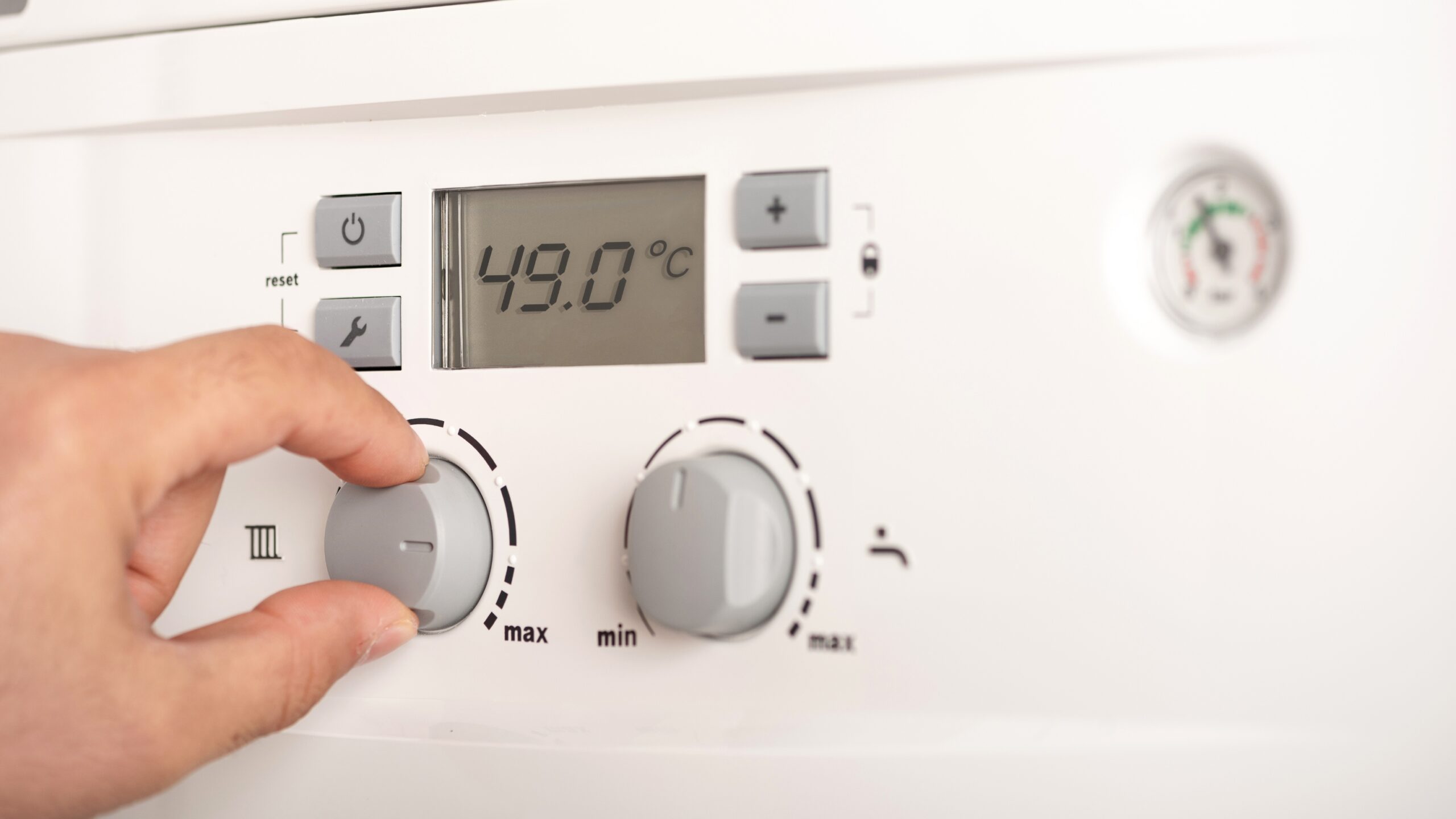 Adjusting temperature on a modern combi boiler control panel