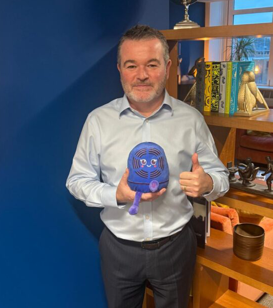 Improveasy CEO with Octopus Trusted Partner mascot