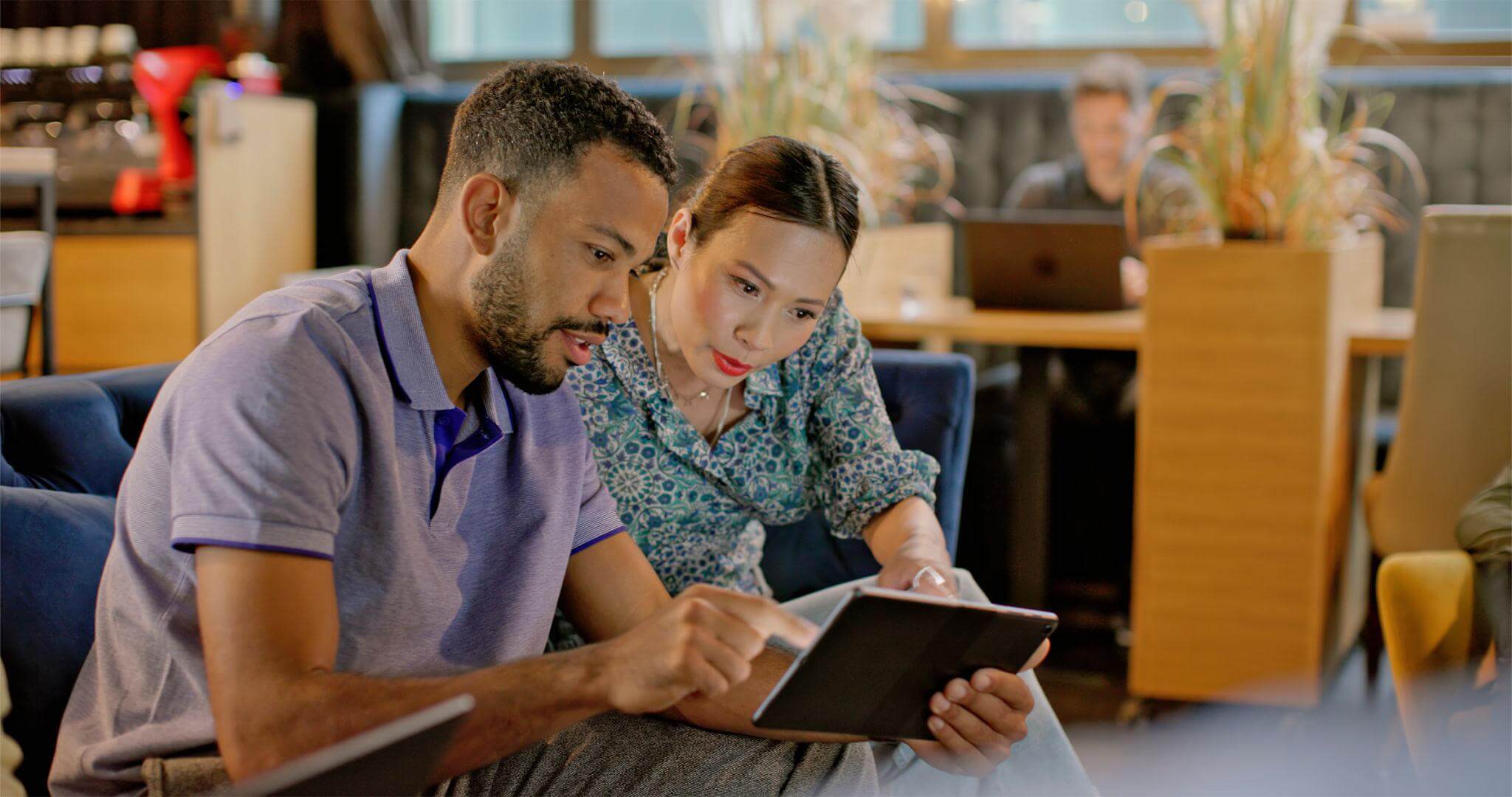 Diverse business professionals review digital content