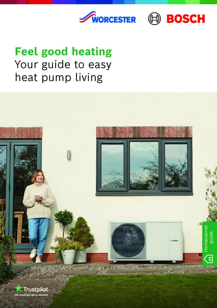 Front cover of a Worcester Bosch homeowner guide titled "Feel good heating: Your guide to easy heat pump living." The image shows a woman standing in a garden next to an outdoor heat pump unit installed against the wall of a modern home.