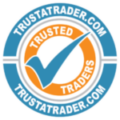 TrustATrader.com "Trusted Traders" circular endorsement logo featuring a blue tick mark inside an orange and blue badge.